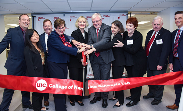 UIC officials formally dedicate the college’s new $6.1 million M. Christine Schwartz Experiential Learning & Simulation Laboratory with a ceremonial ribbon cutting.